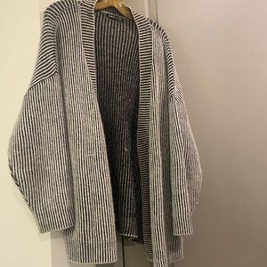 Cozy knit open collar sweater perfect for a rainy or breezy day.